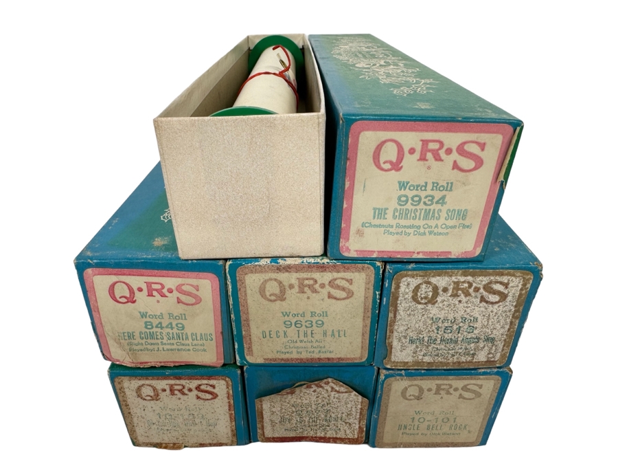 Seven QRS Word Christmas Themed Player Piano Rolls: Here Comes Santa Claus, Deck The Hall, Hark The Herald Angels Sing, Jingle Bell Rock, Joy To The World, Do You Hear What I Hear