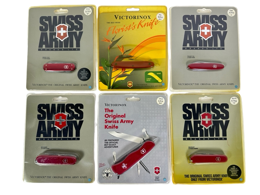 Six New In Packaging Swiss Army Knives Including The Money Clip Knife, The Florist's Knife, The Pocket Pal Knife, Mechanic Knife, The Official Boy Scout Adventurer Knife And Recruit Knife
