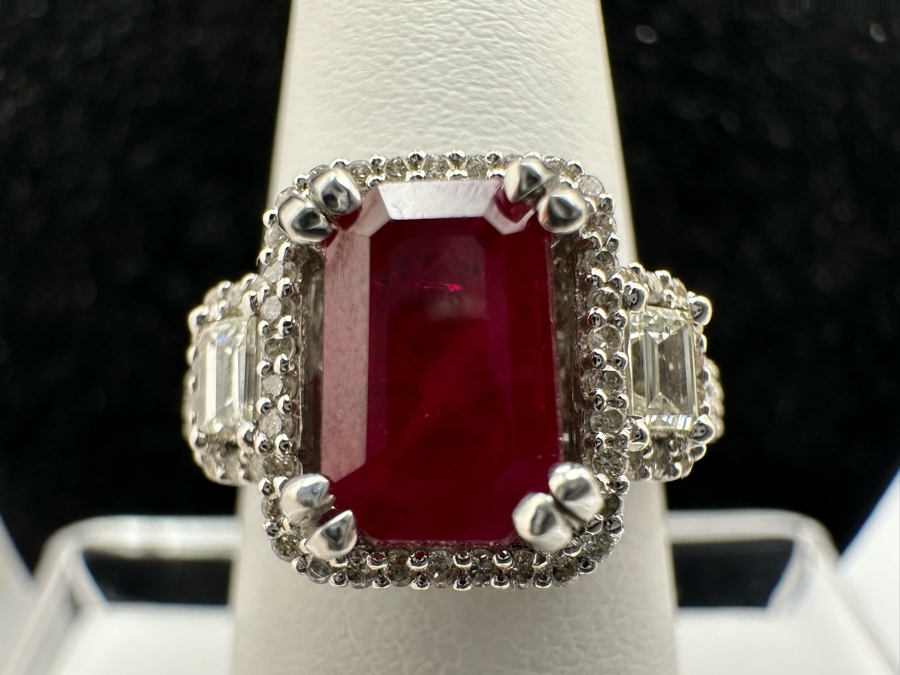 14K Gold Ruby (Lead Glass Fracture Filled) Set With 34 Round Brilliant Diamonds And 2 Emerald Cut Diamonds Est. .55cttw Size 6.75 5.6g Estimated Fair Market Value: $1,200 Retail $3,600 [Photo 4]