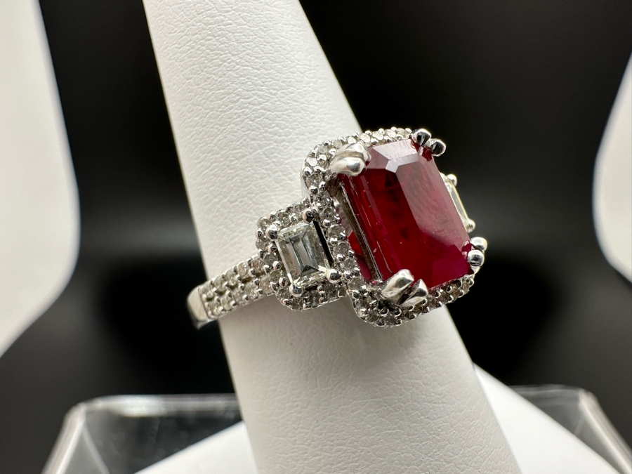 14K Gold Ruby (Lead Glass Fracture Filled) Set With 34 Round Brilliant Diamonds And 2 Emerald Cut Diamonds Est. .55cttw Size 6.75 5.6g Estimated Fair Market Value: $1,200 Retail $3,600 [Photo 7]