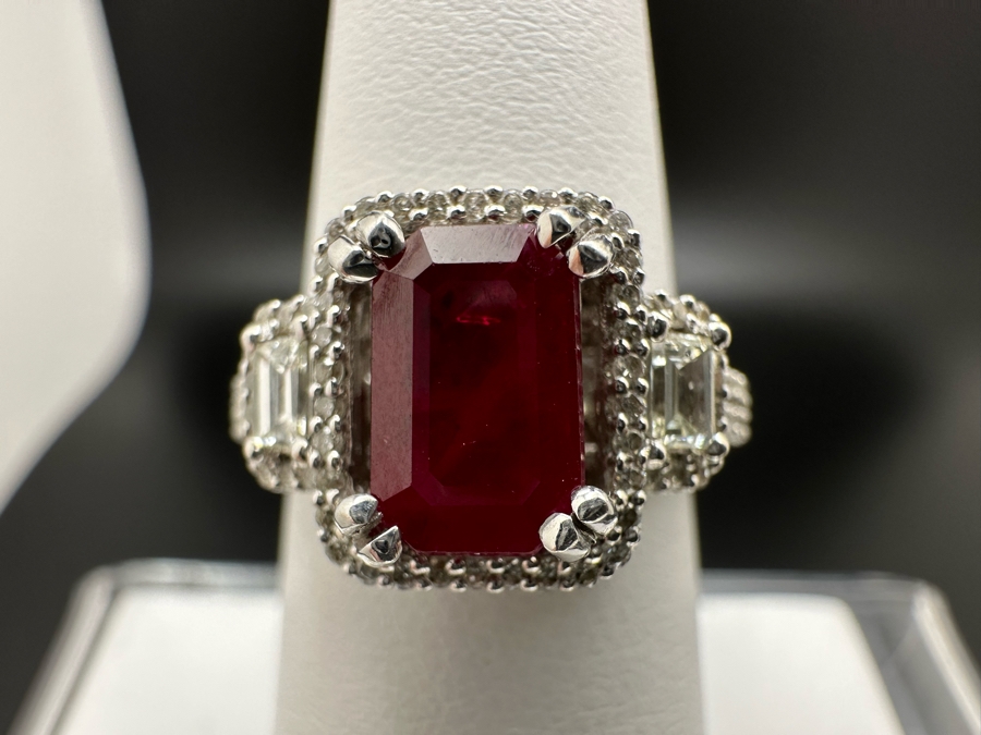 14K Gold Ruby (Lead Glass Fracture Filled) Set With 34 Round Brilliant Diamonds And 2 Emerald Cut Diamonds Est. .55cttw Size 6.75 5.6g Estimated Fair Market Value: $1,200 Retail $3,600 [Photo 5]