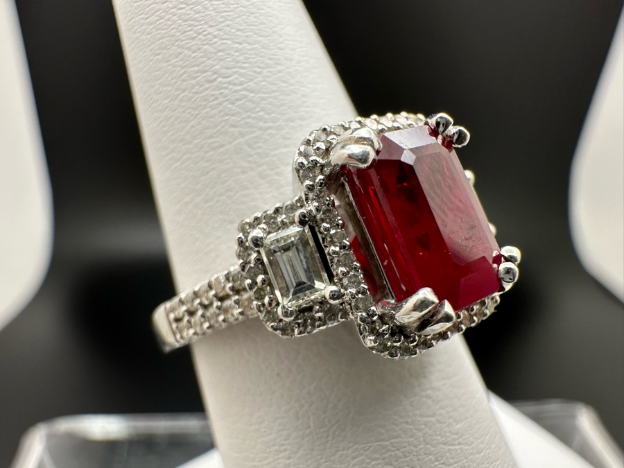 14K Gold Ruby (Lead Glass Fracture Filled) Set With 34 Round Brilliant Diamonds And 2 Emerald Cut Diamonds Est. .55cttw Size 6.75 5.6g Estimated Fair Market Value: $1,200 Retail $3,600 [Photo 8]