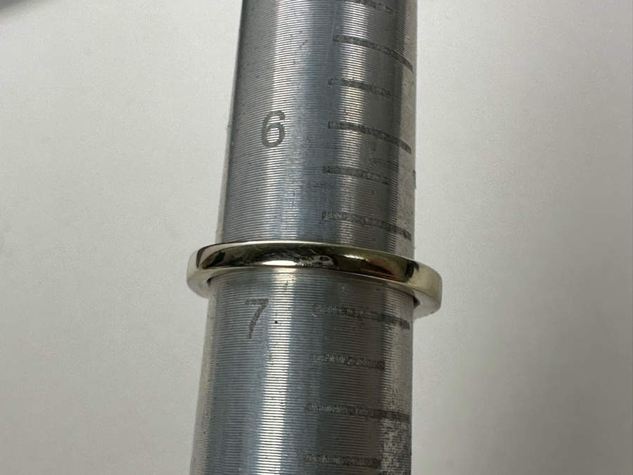 14K Gold Ruby (Lead Glass Fracture Filled) Set With 34 Round Brilliant Diamonds And 2 Emerald Cut Diamonds Est. .55cttw Size 6.75 5.6g Estimated Fair Market Value: $1,200 Retail $3,600 [Photo 16]