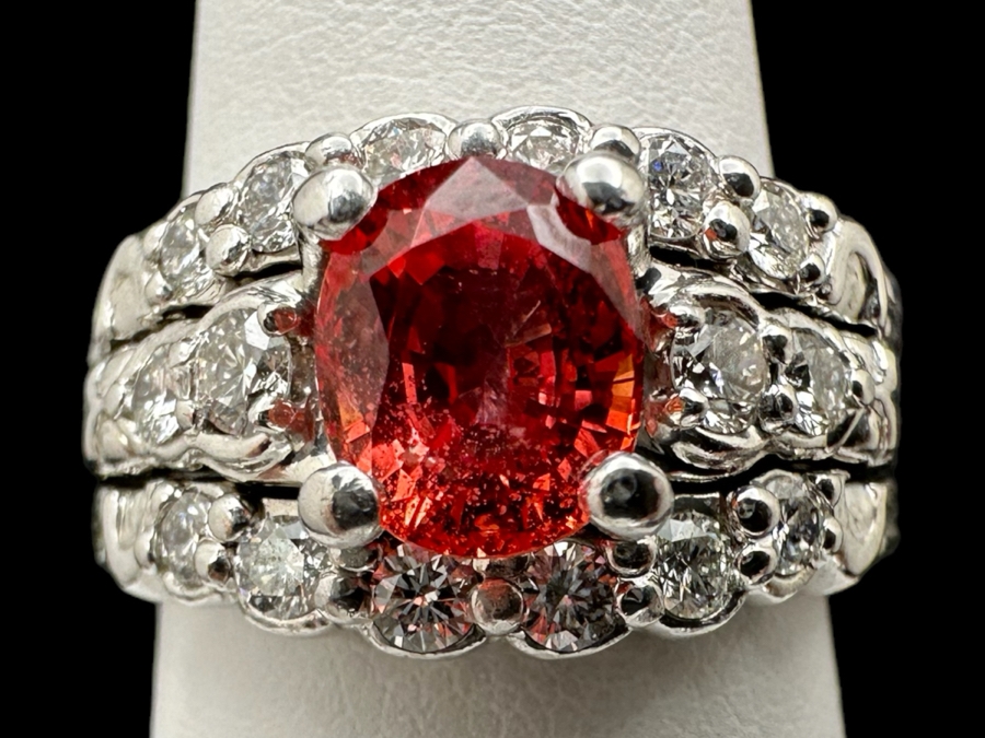 Stunning Platinum 950 Orange Sapphire Ring With 16 Round Brilliant Cut Diamonds Est. 0.60cttw 7.78mm X 6mm Orange Sapphire Size 7.25 15.4g Estimate Fair Market Value $3,500 Retail Value $10,500