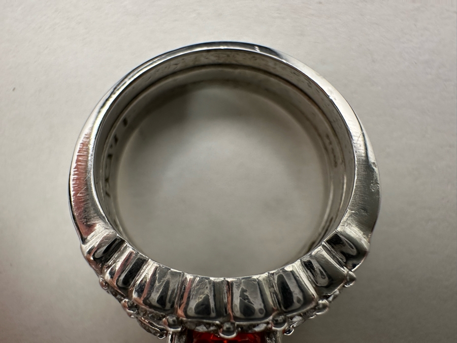 Stunning Platinum 950 Orange Sapphire Ring With 16 Round Brilliant Cut Diamonds Est. 0.60cttw 7.78mm X 6mm Orange Sapphire Size 7.25 15.4g Estimate Fair Market Value $3,500 Retail Value $10,500 [Photo 14]