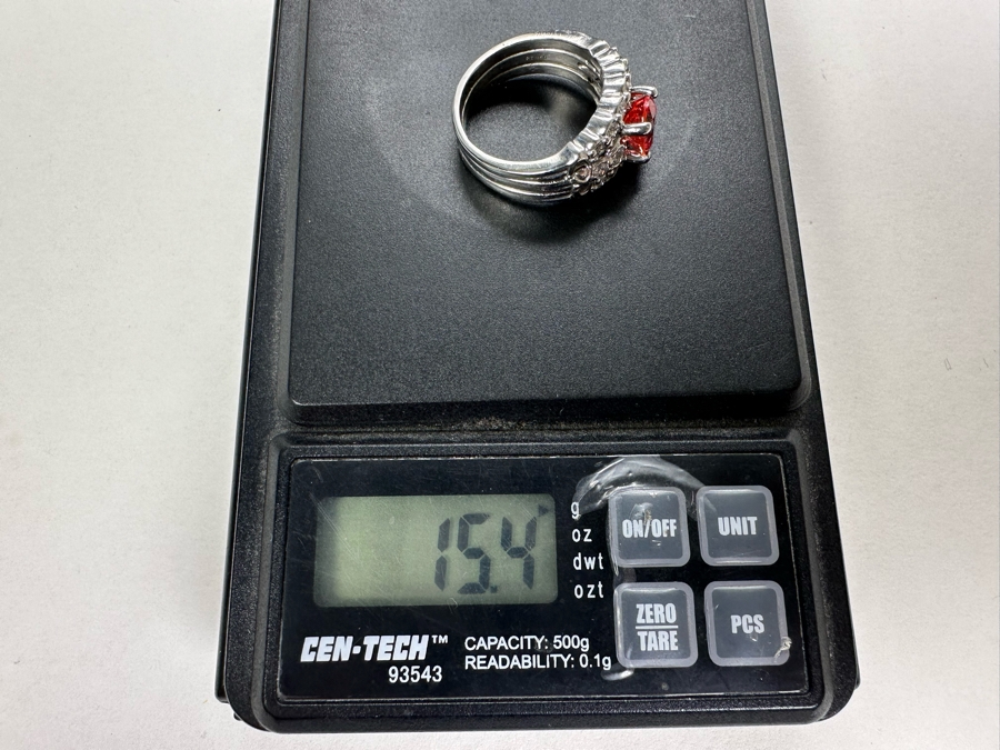 Stunning Platinum 950 Orange Sapphire Ring With 16 Round Brilliant Cut Diamonds Est. 0.60cttw 7.78mm X 6mm Orange Sapphire Size 7.25 15.4g Estimate Fair Market Value $3,500 Retail Value $10,500 [Photo 19]