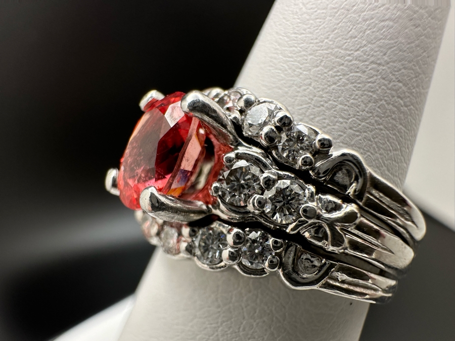 Stunning Platinum 950 Orange Sapphire Ring With 16 Round Brilliant Cut Diamonds Est. 0.60cttw 7.78mm X 6mm Orange Sapphire Size 7.25 15.4g Estimate Fair Market Value $3,500 Retail Value $10,500 [Photo 11]