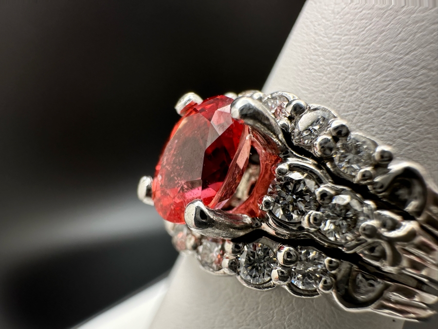 Stunning Platinum 950 Orange Sapphire Ring With 16 Round Brilliant Cut Diamonds Est. 0.60cttw 7.78mm X 6mm Orange Sapphire Size 7.25 15.4g Estimate Fair Market Value $3,500 Retail Value $10,500 [Photo 12]