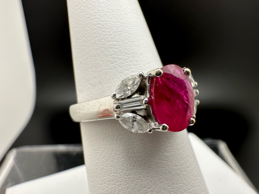 18K Gold Oval Shape Ruby (Lead Glass Fracture Filled) Accented With 2 Baguette Diamonds And 4 Marquise Shape Diamonds G-H Color Si1 Clarity Est. .40cttw Ruby 8mm X 6mm Size 7.25 5.2g Estimated Fair Market Value $1,200 Retail $3,600 [Photo 4]