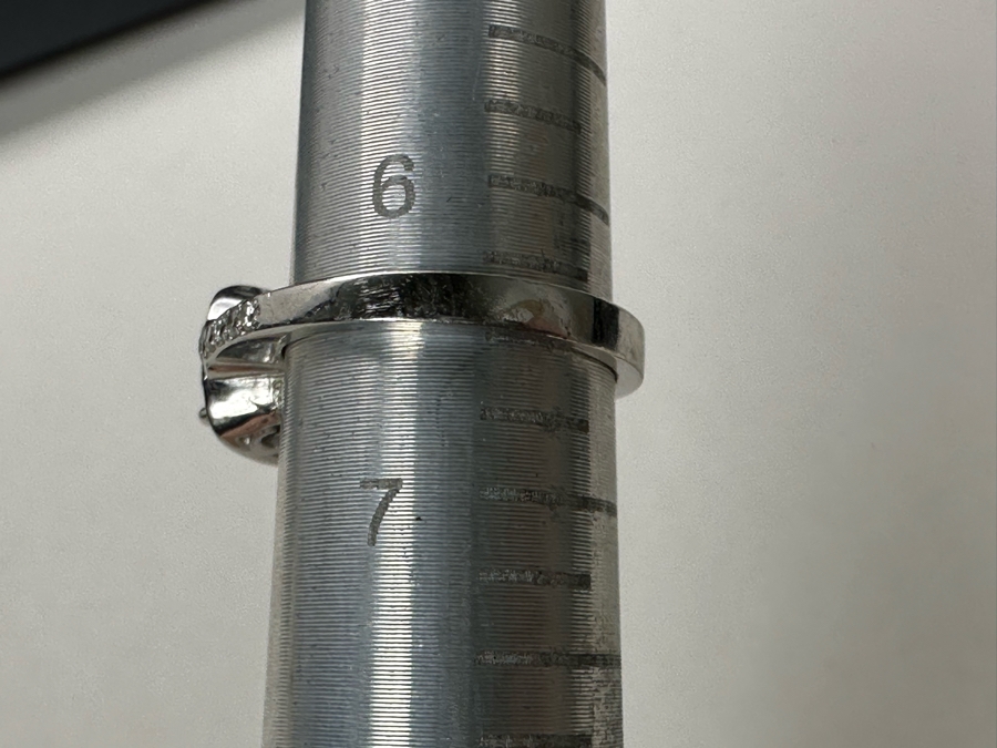 14K Gold Blue Zircon Ring Set With 25 Round Brilliant Diamonds Est. .35cttw Center Stone Blue Zircon 6.4mm X 6.4mm Est. 1cttw Size 6.5 4.8g Estimate Fair Market Value $800 Retail Value $2,400 [Photo 15]