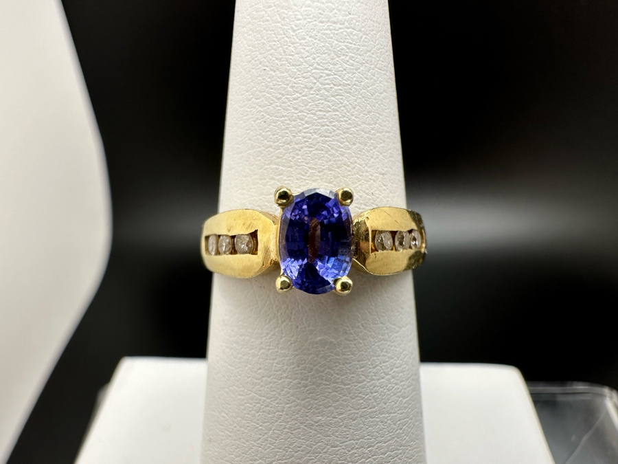 14K Gold Tanzanite Ring Set With 6 Round Brilliant Diamonds Est. .12cttw Tanzanite 6mm X 4mm 3.4g Size 6.5 Estimated Fair Market Value $500 Retail Value $1,500 [Photo 3]