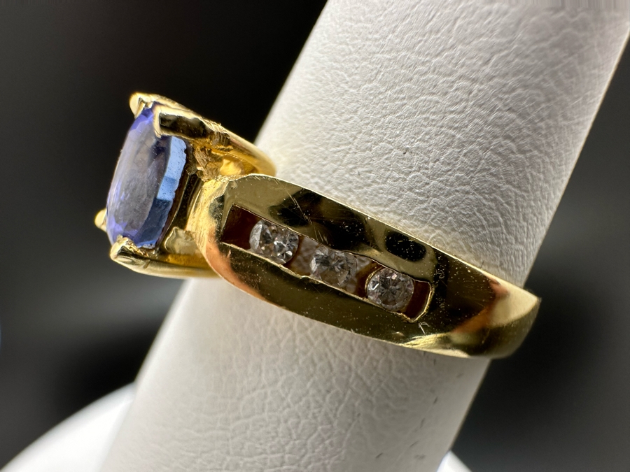 14K Gold Tanzanite Ring Set With 6 Round Brilliant Diamonds Est. .12cttw Tanzanite 6mm X 4mm 3.4g Size 6.5 Estimated Fair Market Value $500 Retail Value $1,500 [Photo 8]