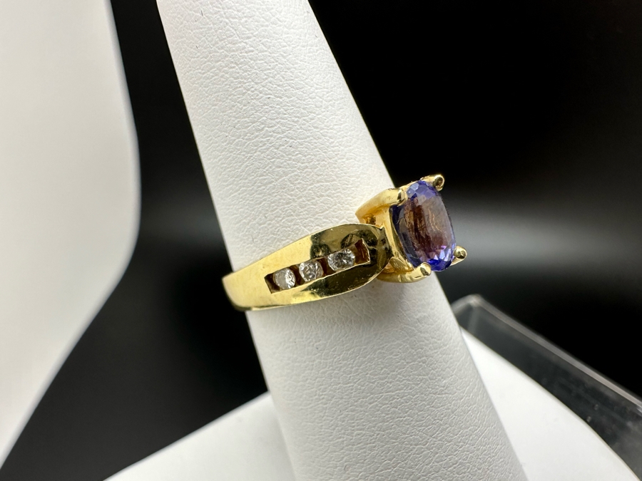 14K Gold Tanzanite Ring Set With 6 Round Brilliant Diamonds Est. .12cttw Tanzanite 6mm X 4mm 3.4g Size 6.5 Estimated Fair Market Value $500 Retail Value $1,500 [Photo 4]