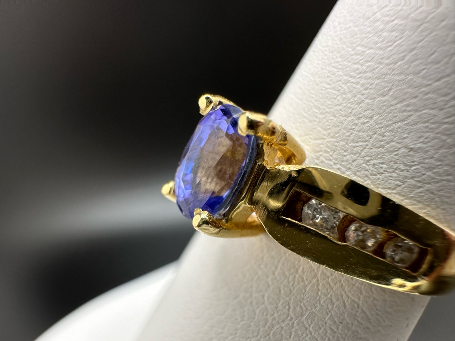 14K Gold Tanzanite Ring Set With 6 Round Brilliant Diamonds Est. .12cttw Tanzanite 6mm X 4mm 3.4g Size 6.5 Estimated Fair Market Value $500 Retail Value $1,500 [Photo 9]