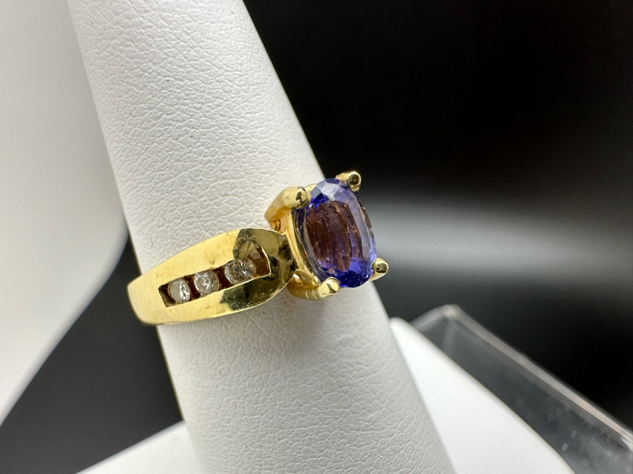14K Gold Tanzanite Ring Set With 6 Round Brilliant Diamonds Est. .12cttw Tanzanite 6mm X 4mm 3.4g Size 6.5 Estimated Fair Market Value $500 Retail Value $1,500 [Photo 5]