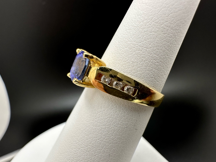 14K Gold Tanzanite Ring Set With 6 Round Brilliant Diamonds Est. .12cttw Tanzanite 6mm X 4mm 3.4g Size 6.5 Estimated Fair Market Value $500 Retail Value $1,500 [Photo 7]