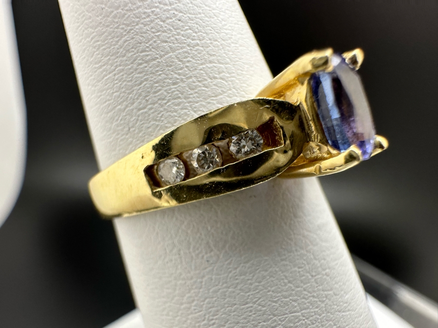 14K Gold Tanzanite Ring Set With 6 Round Brilliant Diamonds Est. .12cttw Tanzanite 6mm X 4mm 3.4g Size 6.5 Estimated Fair Market Value $500 Retail Value $1,500 [Photo 6]