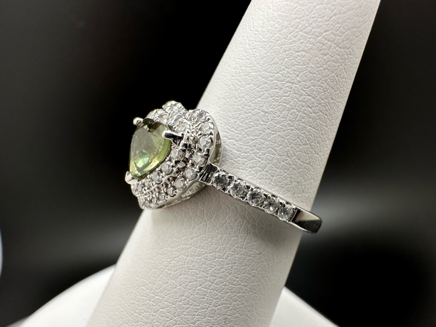 14K Gold Heart Shape Synthetic Alexanderite Ring Set With 52 Round Brilliant Diamonds Est. .40cttw Center Stone 6mm X 6mm Synthetic Alexanderite Est. 1cttw 3.1g Size 6.75 Estimated Fair Market Value $900 Retail Value $2,700 [Photo 9]