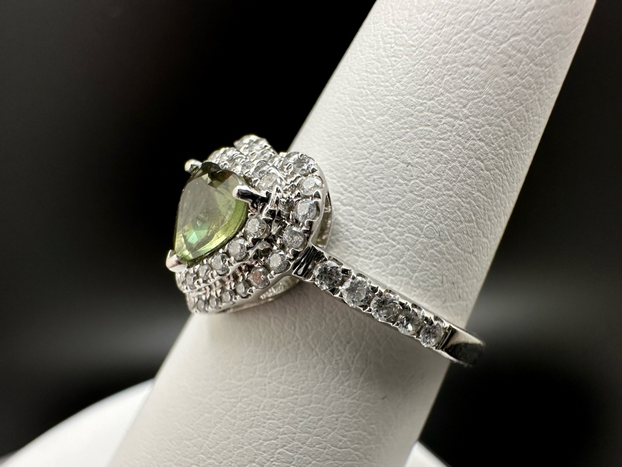 14K Gold Heart Shape Synthetic Alexanderite Ring Set With 52 Round Brilliant Diamonds Est. .40cttw Center Stone 6mm X 6mm Synthetic Alexanderite Est. 1cttw 3.1g Size 6.75 Estimated Fair Market Value $900 Retail Value $2,700 [Photo 10]