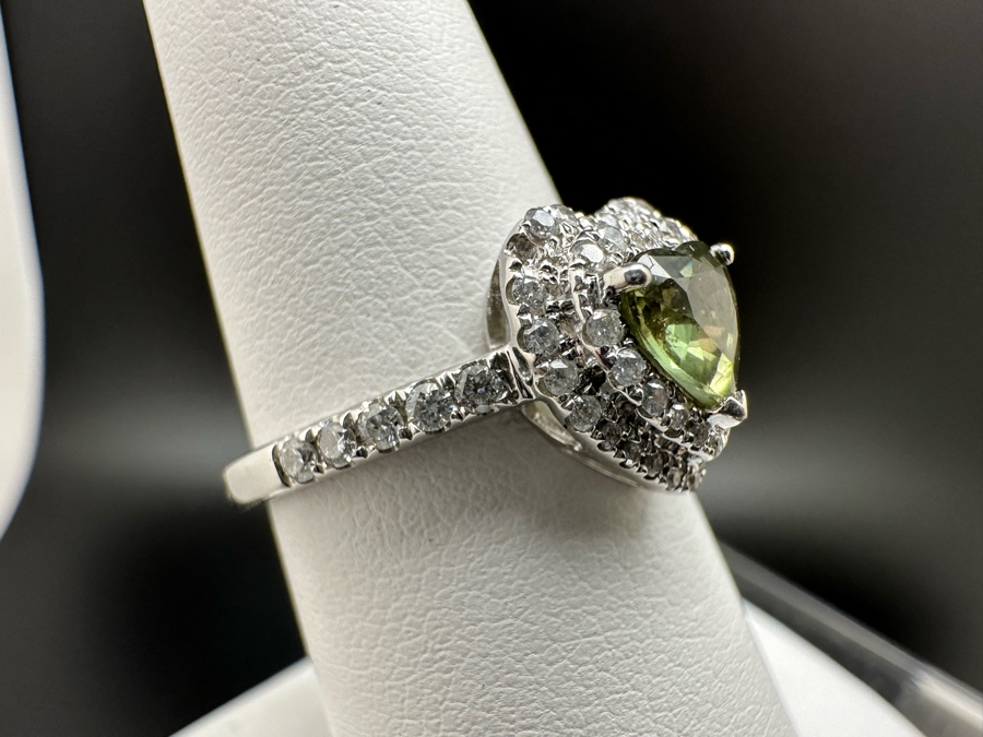 14K Gold Heart Shape Synthetic Alexanderite Ring Set With 52 Round Brilliant Diamonds Est. .40cttw Center Stone 6mm X 6mm Synthetic Alexanderite Est. 1cttw 3.1g Size 6.75 Estimated Fair Market Value $900 Retail Value $2,700 [Photo 8]