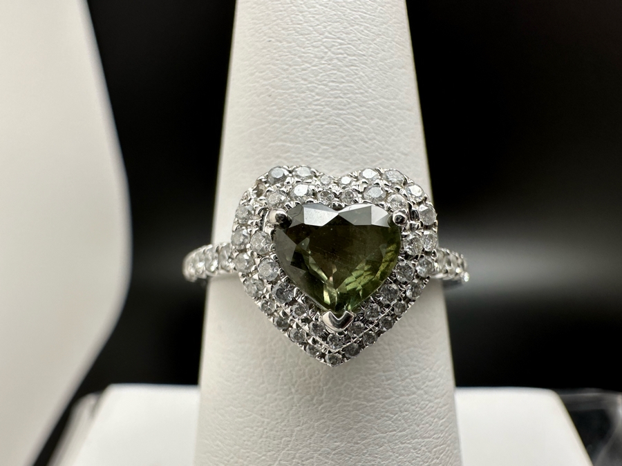 14K Gold Heart Shape Synthetic Alexanderite Ring Set With 52 Round Brilliant Diamonds Est. .40cttw Center Stone 6mm X 6mm Synthetic Alexanderite Est. 1cttw 3.1g Size 6.75 Estimated Fair Market Value $900 Retail Value $2,700 [Photo 4]