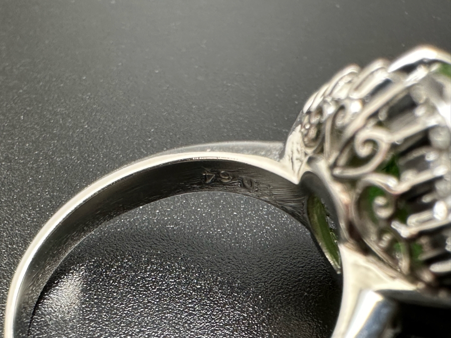 Platinum 900 Oval Green Jade 12.5mm X 9.75mm 4.6Ct Set With 14 1.5mm Round Brilliant Diamonds & 10 Tapered Baguette Diamonds Estimated .64cttw Ring Size 6.5 8.9g Estimated Value $1,675 [Photo 18]