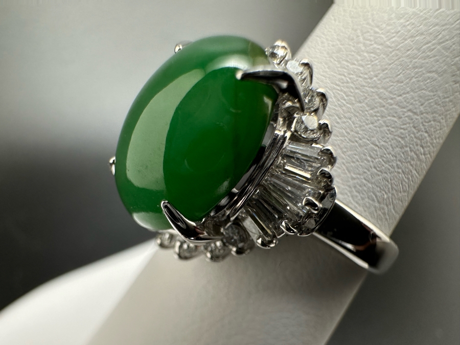 Platinum 900 Oval Green Jade 12.5mm X 9.75mm 4.6Ct Set With 14 1.5mm Round Brilliant Diamonds & 10 Tapered Baguette Diamonds Estimated .64cttw Ring Size 6.5 8.9g Estimated Value $1,675 [Photo 8]