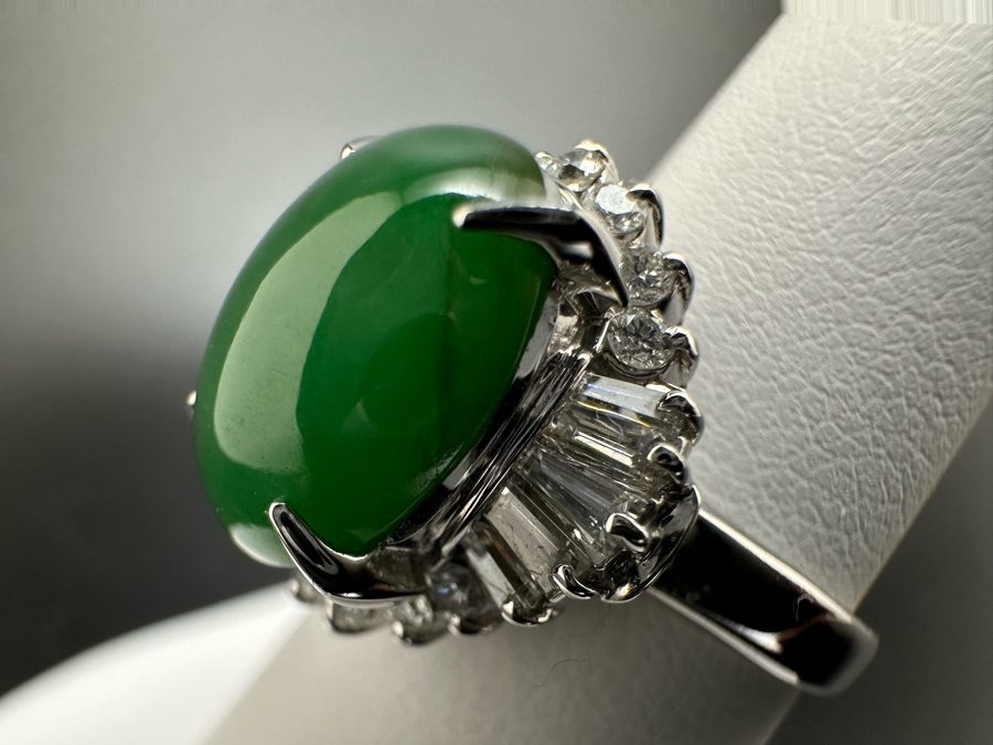 Platinum 900 Oval Green Jade 12.5mm X 9.75mm 4.6Ct Set With 14 1.5mm Round Brilliant Diamonds & 10 Tapered Baguette Diamonds Estimated .64cttw Ring Size 6.5 8.9g Estimated Value $1,675 [Photo 9]