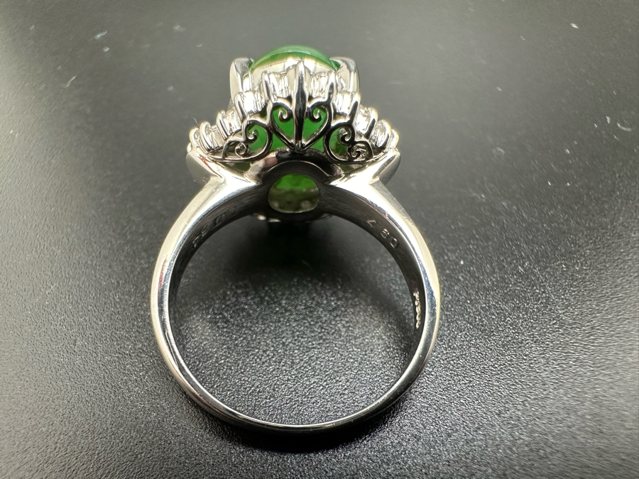 Platinum 900 Oval Green Jade 12.5mm X 9.75mm 4.6Ct Set With 14 1.5mm Round Brilliant Diamonds & 10 Tapered Baguette Diamonds Estimated .64cttw Ring Size 6.5 8.9g Estimated Value $1,675 [Photo 15]