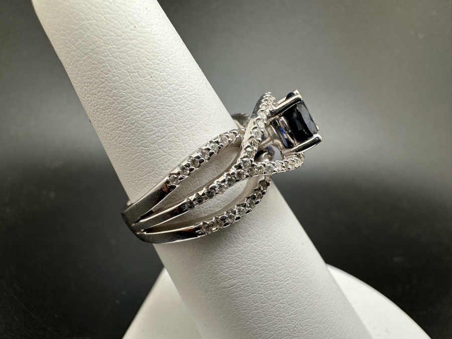 18K Gold Dark Blue Sapphire 6mm Est. 1.1Ct Set With 96 .01Ct Round Brilliant Diamonds Est. 1cttw 6.8g Size 6.5 Estimated Value $2,300 [Photo 8]