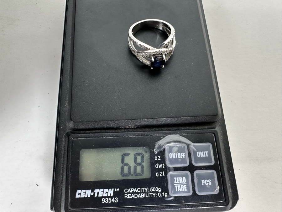 18K Gold Dark Blue Sapphire 6mm Est. 1.1Ct Set With 96 .01Ct Round Brilliant Diamonds Est. 1cttw 6.8g Size 6.5 Estimated Value $2,300 [Photo 13]