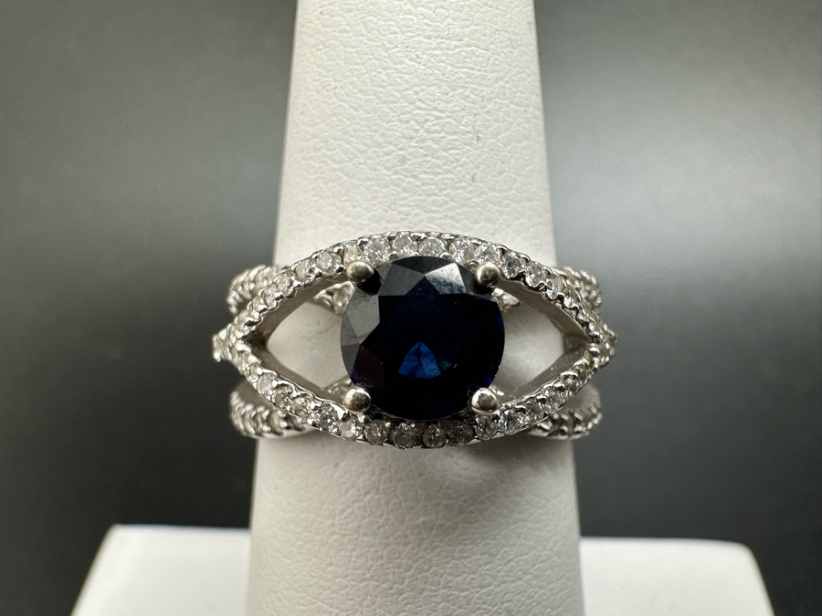 18K Gold Dark Blue Sapphire 6mm Est. 1.1Ct Set With 96 .01Ct Round Brilliant Diamonds Est. 1cttw 6.8g Size 6.5 Estimated Value $2,300 [Photo 4]