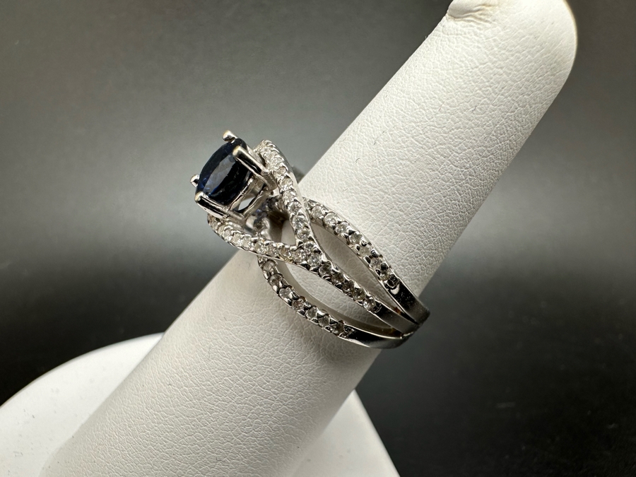 18K Gold Dark Blue Sapphire 6mm Est. 1.1Ct Set With 96 .01Ct Round Brilliant Diamonds Est. 1cttw 6.8g Size 6.5 Estimated Value $2,300 [Photo 9]