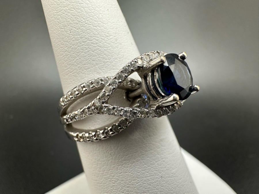 18K Gold Dark Blue Sapphire 6mm Est. 1.1Ct Set With 96 .01Ct Round Brilliant Diamonds Est. 1cttw 6.8g Size 6.5 Estimated Value $2,300 [Photo 6]