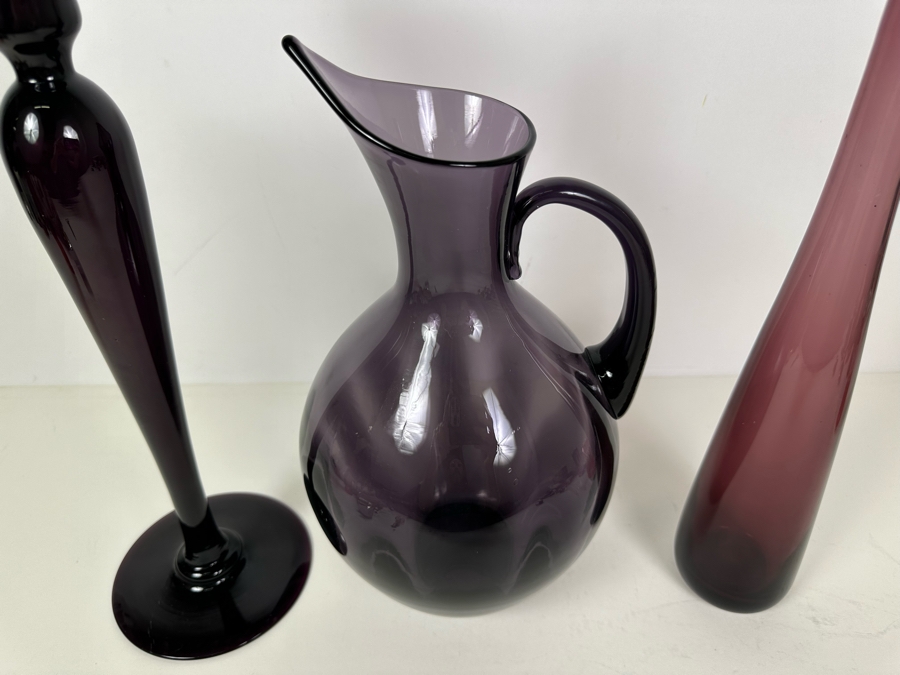 Vintage Pairpoint Glass Candlestick 16'H  (L), Vintage Blenko Glass Optic Pitcher No. 991 Designed By Winslow Anderson 13'H (M), Blenko Glass Vase By Wayne Husted 15'H (R) Purple Amethyst Violet [Photo 3]