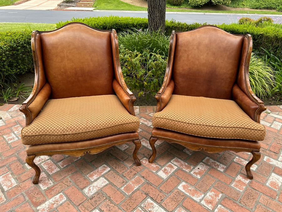 Pair Of Leather Wingback Armchairs With Brass Nailheads 35'W X 44'D X 44'H [Photo 1]