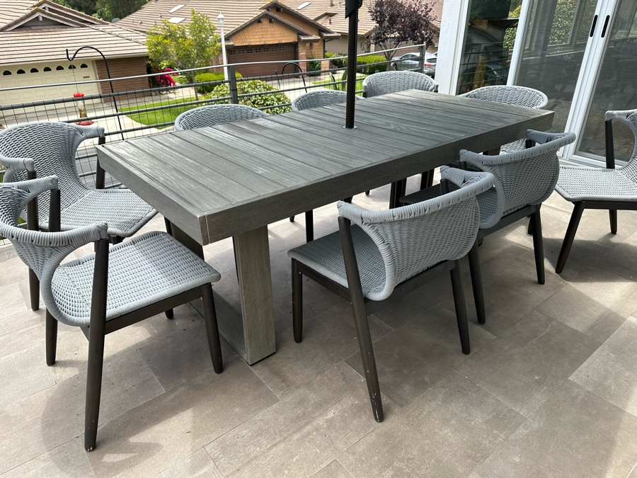 West Elm Outdoor Dining Table 77W X 36D X 30H With Umbrella And Nine AllModern Modernist Woven Rope Chairs (Nine Chairs Retails For $3,200) [Photo 2]