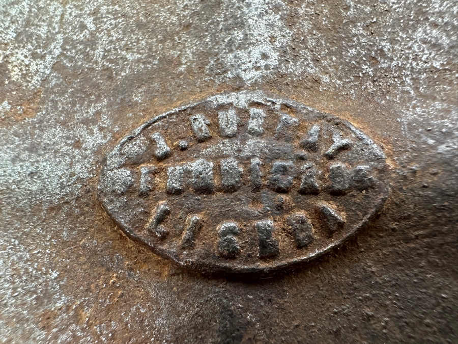 Antique Cast Iron Tobacco Jar In Shape Of A Package Wrapped With Rope Bearing An AR Star, The Number 23, The Word Piano And A Glass With Makers Mark Underneath Box [Photo 10]