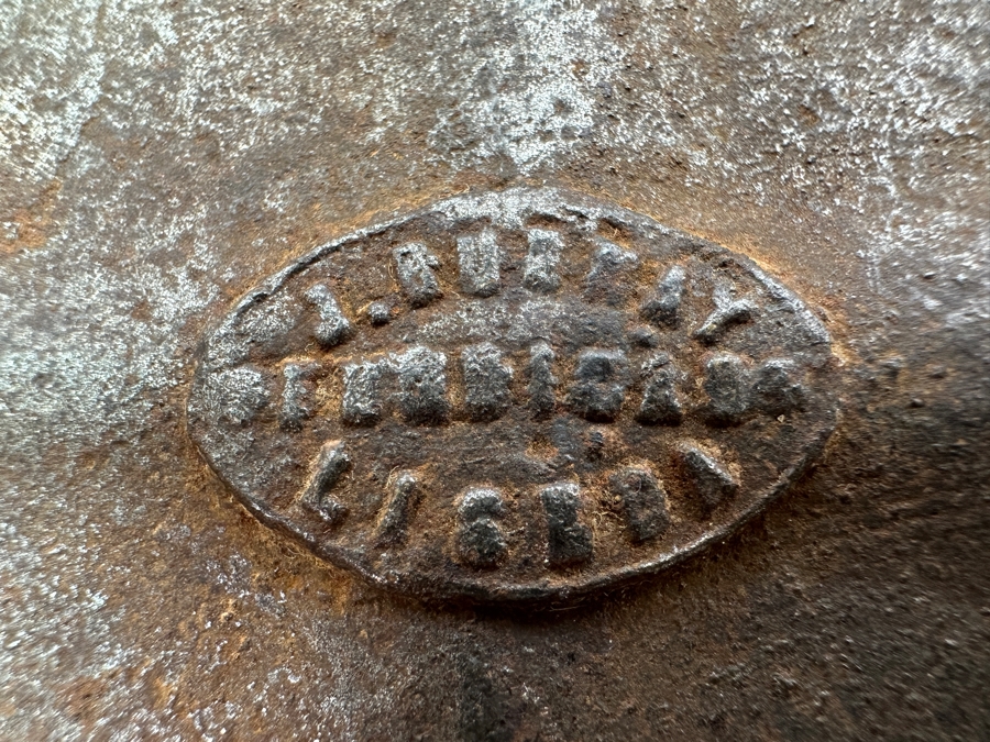 Antique Cast Iron Tobacco Jar In Shape Of A Package Wrapped With Rope Bearing An AR Star, The Number 23, The Word Piano And A Glass With Makers Mark Underneath Box [Photo 11]