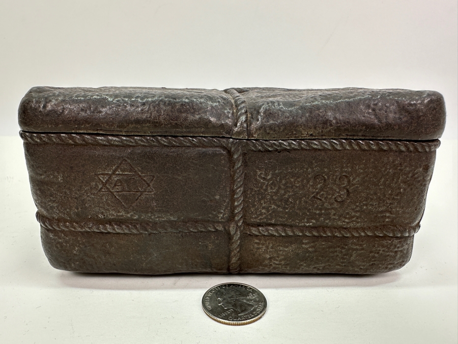 Antique Cast Iron Tobacco Jar In Shape Of A Package Wrapped With Rope Bearing An AR Star, The Number 23, The Word Piano And A Glass With Makers Mark Underneath Box [Photo 3]