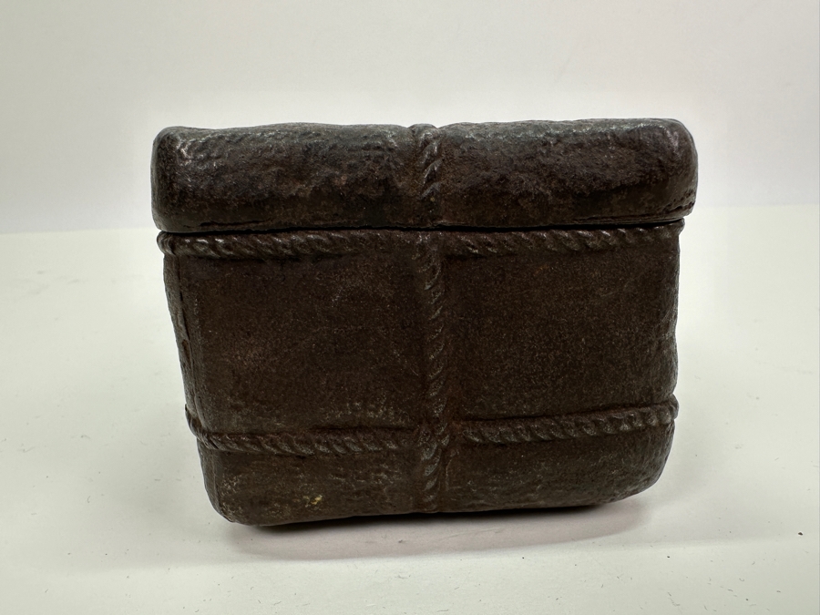 Antique Cast Iron Tobacco Jar In Shape Of A Package Wrapped With Rope Bearing An AR Star, The Number 23, The Word Piano And A Glass With Makers Mark Underneath Box [Photo 14]