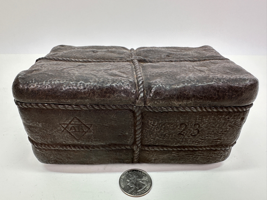 Antique Cast Iron Tobacco Jar In Shape Of A Package Wrapped With Rope Bearing An AR Star, The Number 23, The Word Piano And A Glass With Makers Mark Underneath Box [Photo 4]