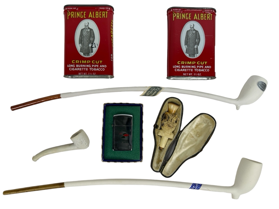 Tobacco Smoking Lot: Pair Of New Gouda Holland Long Porcelain Pipes, A Carved Meerschaum Owl Pipe Without The Stem, Small Porelain Pipe,  Chevrolet Los Angeles 1966 Safety Award PARK Lighter And Pair Of Prince Albert Tins