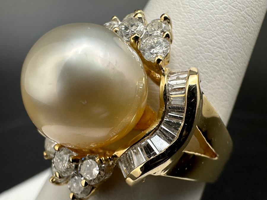 14K Gold Ring (9.6g) with 11mm Cultured Pearl, .80 cttw Round Brilliant Diamonds + .50 cttw Baguette Diamonds Size 7 Fair Market Value $1,700 Retail $3,400 [Photo 13]