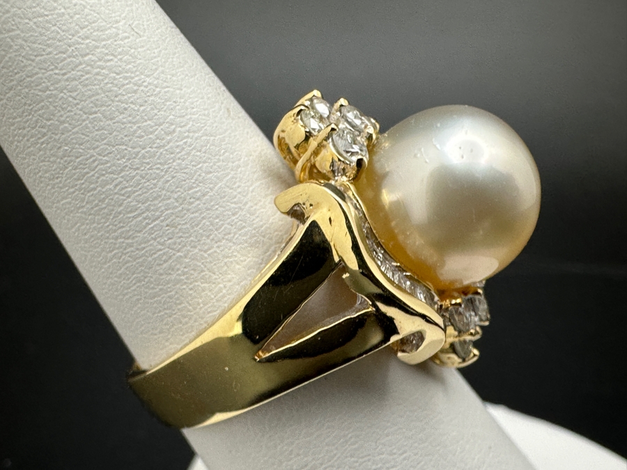 14K Gold Ring (9.6g) with 11mm Cultured Pearl, .80 cttw Round Brilliant Diamonds + .50 cttw Baguette Diamonds Size 7 Fair Market Value $1,700 Retail $3,400 [Photo 10]