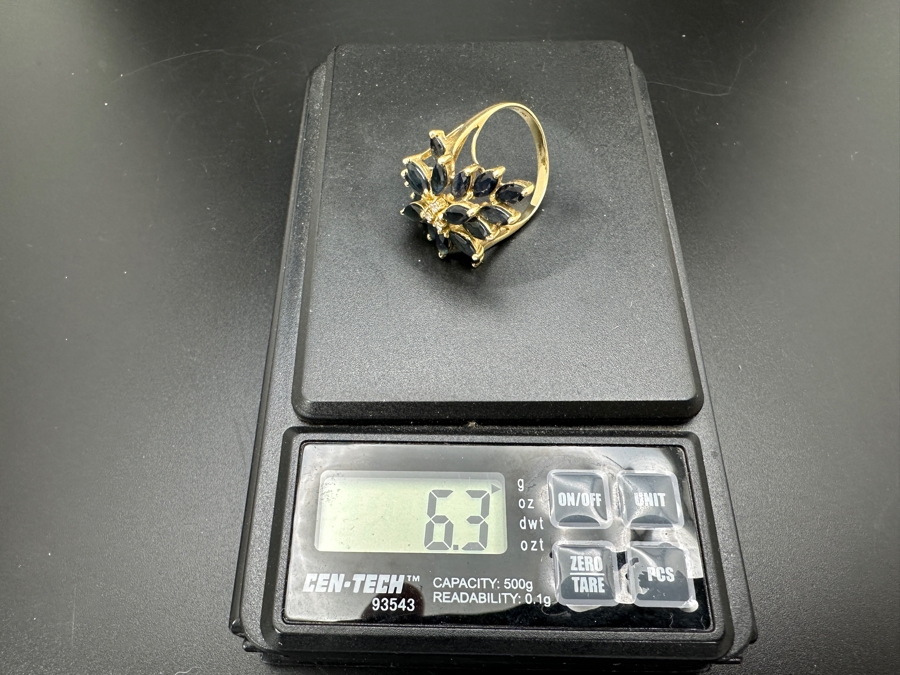 14K Gold Mozambique Sapphire / Diamond Ring (18) 6 x 3 Blue Sapphires Estimated 5.76cttw Accented With (3) Diamonds .03cttw Size 7 6.3g Retail Value $2,200 [Photo 15]