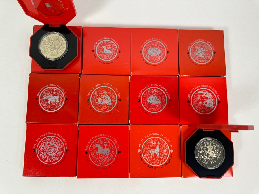 Singapore $10 Dollar Proof-Like Coins From 1993-2004: 1993,94,95,96,97,98,99,00,01,02,03,2004 Monetary Authority Of Singapore - 12 Coins Copper-Nickel Composition [Photo 1]