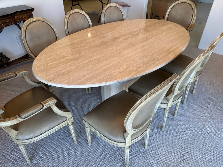 Stunning Italian Travertine Oval Dining Table With Travertine Pedestal Base By Stone International 78'L X 47'W X 29.5'H And Eight Kindel Grand Rapids Dining Chairs [Photo 1]