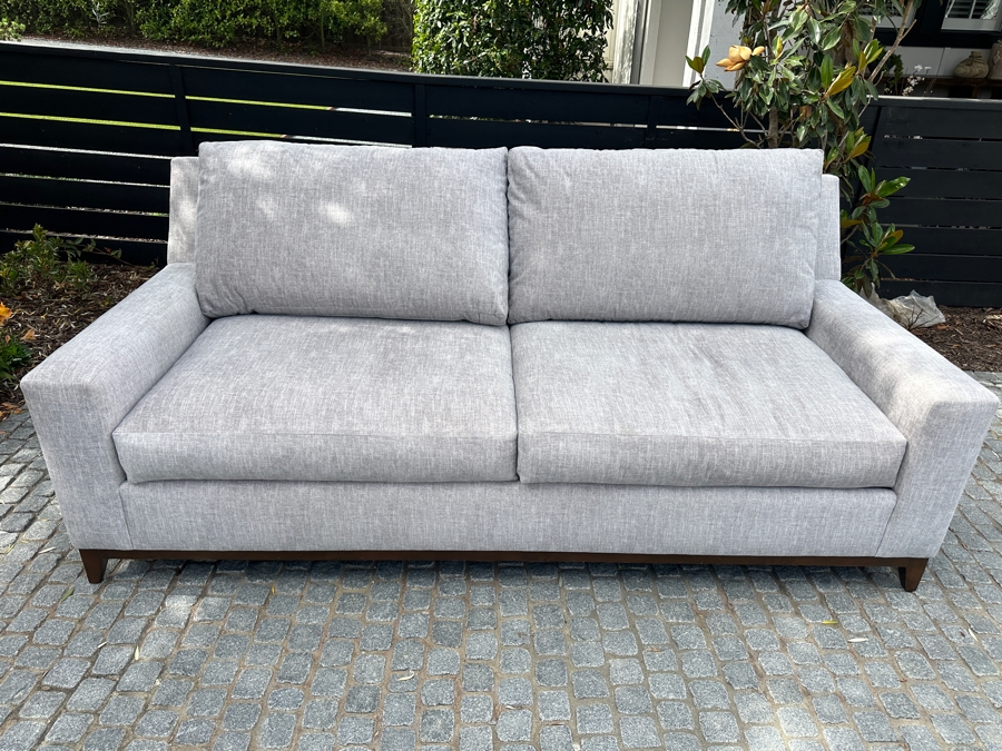 Contemporary Upholstered 2-Cushion Sofa With Wooden Base 91'W X 42'D X 38'H (Photo Shows Reflection Of Sunlight Through The Trees)