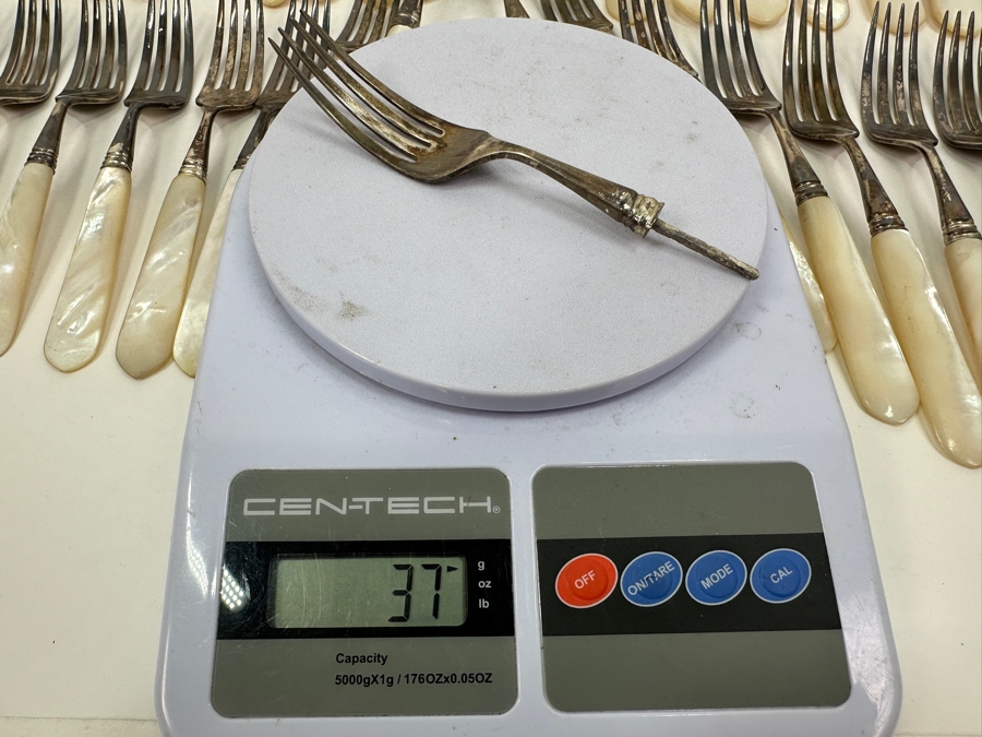 Atkinson Bros Sheffield England Flatware W/ Mother Of Pearl Handles & Sterling Silver Forks Marked With A Crown:(12) Dinner Knives, (11) Dinner Forks, (12) Small Knives, (11) Dessert Forks Approximate Silver Weight 748g Apx. Silver Melt Value $847 [Photo 11]